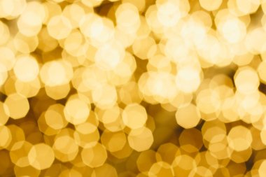 Noel ve yeni yıl olay sırasında beyaz Bokeh katları ile sarı arka plan bulanık