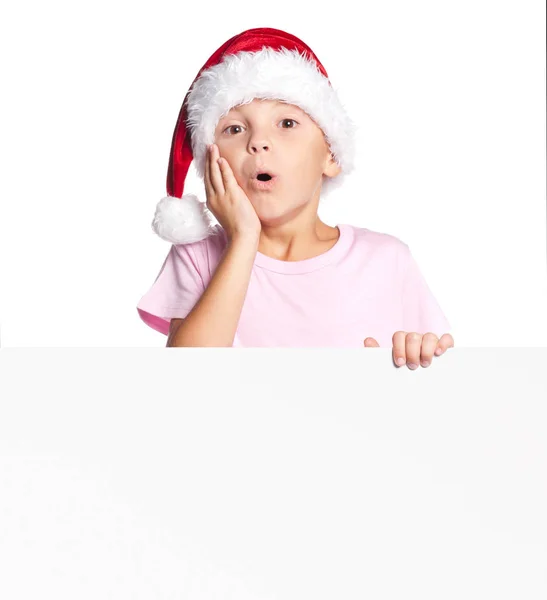 Junge mit Weihnachtsmütze mit Blanko — Stockfoto