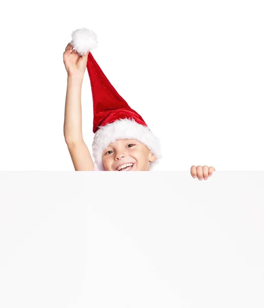 Menino em chapéu de Papai Noel com branco — Fotografia de Stock