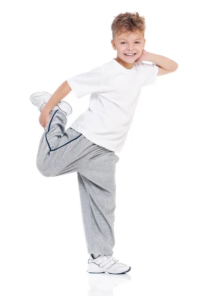 Kleine jongen dansen op wit — Stockfoto