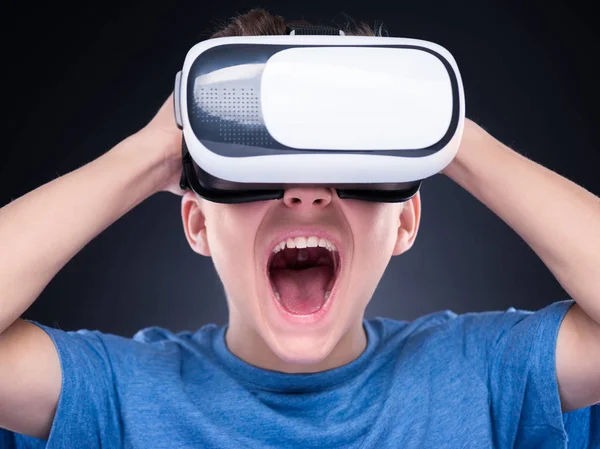 Teen boy in VR glasses — Stock Photo, Image