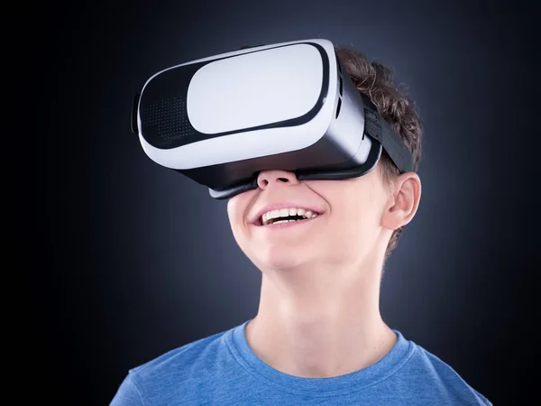 Teen boy in VR glasses — Stock Photo, Image