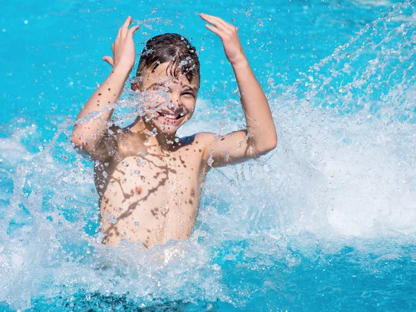 Happy boy in pool — Stock Photo, Image