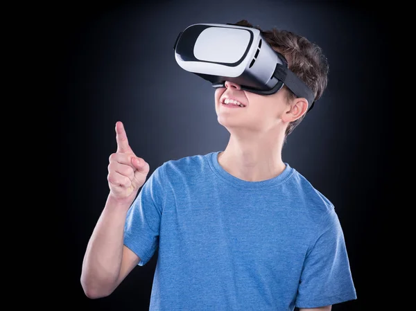 Teen boy in VR glasses — Stock Photo, Image