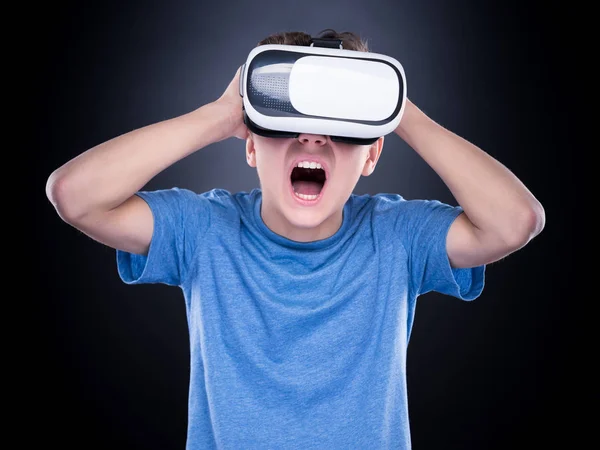 Teen boy in VR glasses — Stock Photo, Image