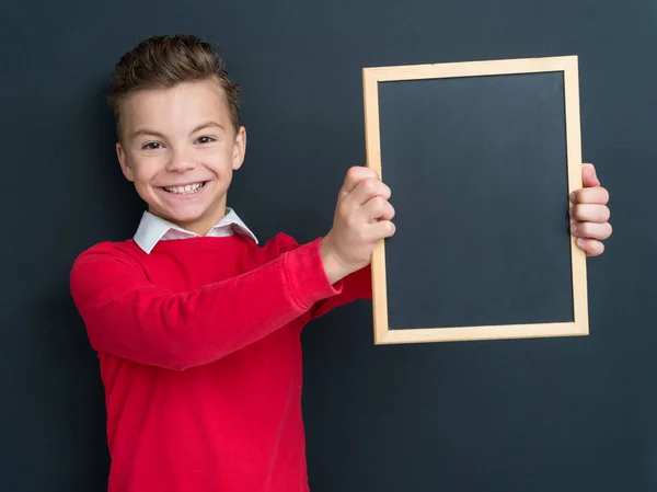 Teen boy with small blackboard — Stock Photo, Image