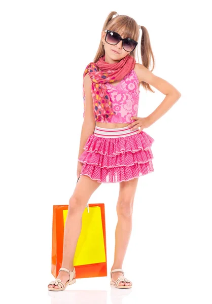 Kislány a bevásárló szatyrok — Stock Fotó