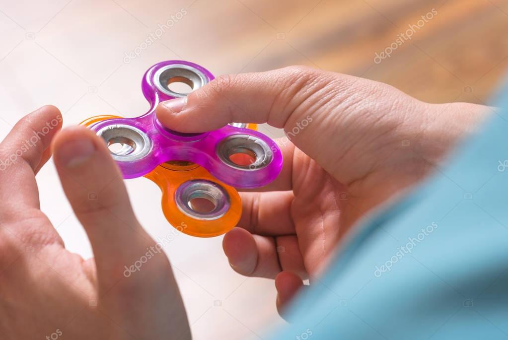 Hand with spinner toy