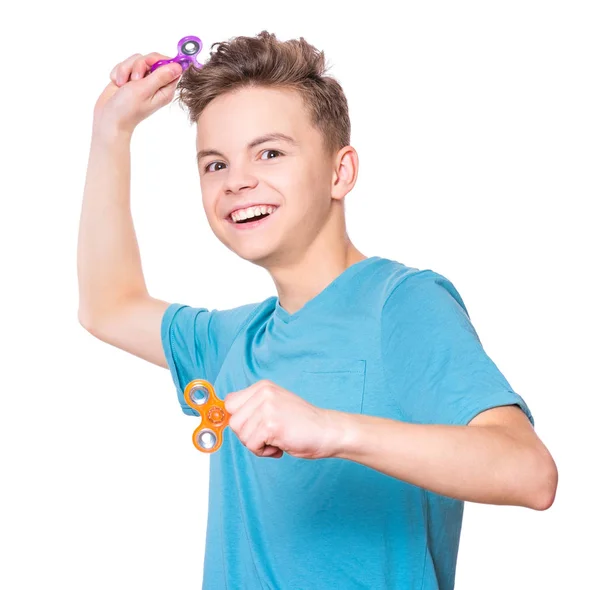 Tiener jongen met spinner op wit — Stockfoto
