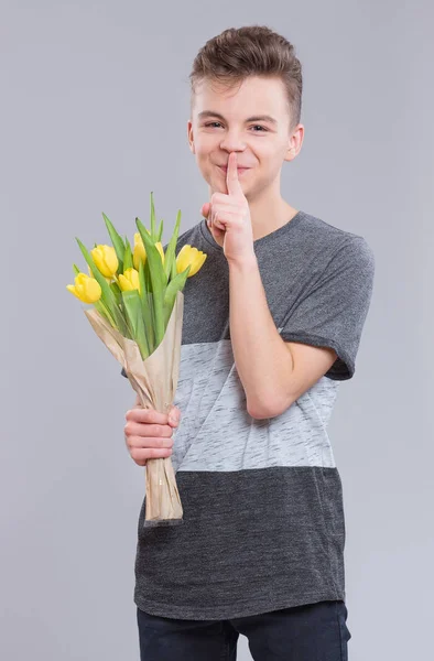 Teen boy with flowers — Stock Photo, Image