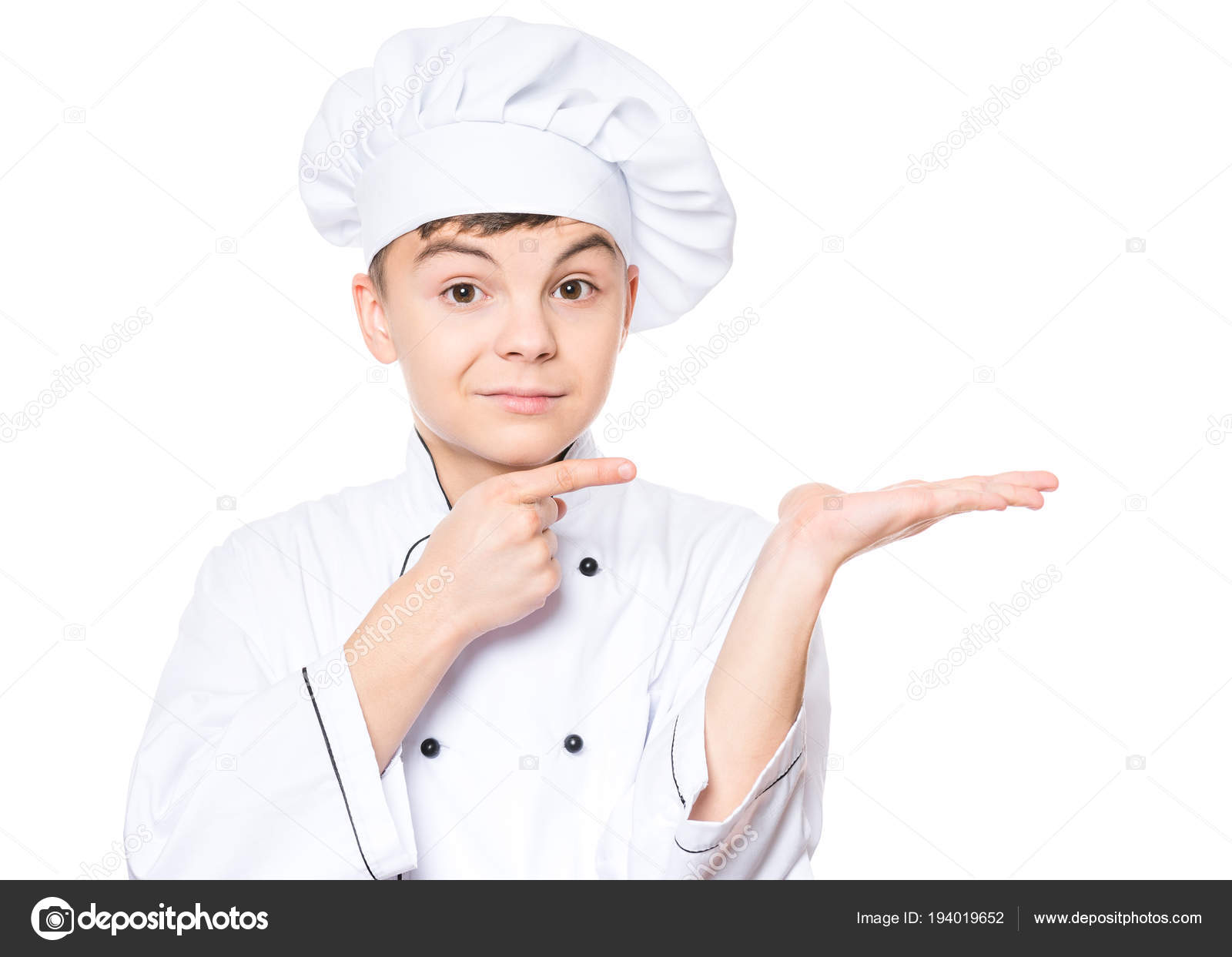 Teen boy wearing chef uniform Stock Photo by ©VaLiza 194019652