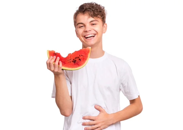 Teen chlapec jíst meloun — Stock fotografie