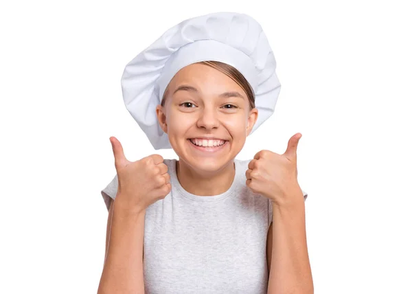 一个戴着厨师帽的快乐少女的画像 用大拇指做手势 与白色背景隔离 儿童厨师或面包师笑着看着相机 — 图库照片