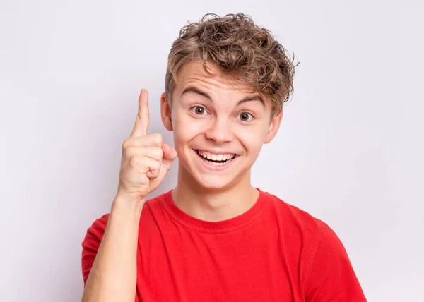 Portrait Smiling Teen Boy Pointing Great Idea Grey Background Awesome — Stock Photo, Image