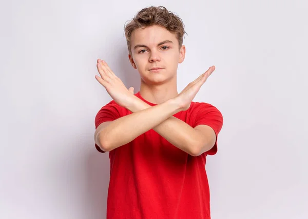 Portrait Teen Boy Doing Stop Sign Crossed Hands Grey Background — Stock Photo, Image