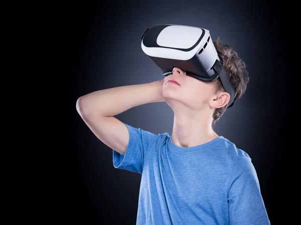 Happy Teen Boy Wearing Virtual Reality Goggles Watching Movies Playing Royalty Free Stock Photos