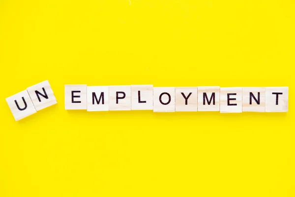 Word unemployment on yellow background. Job board. Human Resource Management and Recruitment and Hiring concept — Stock Photo, Image