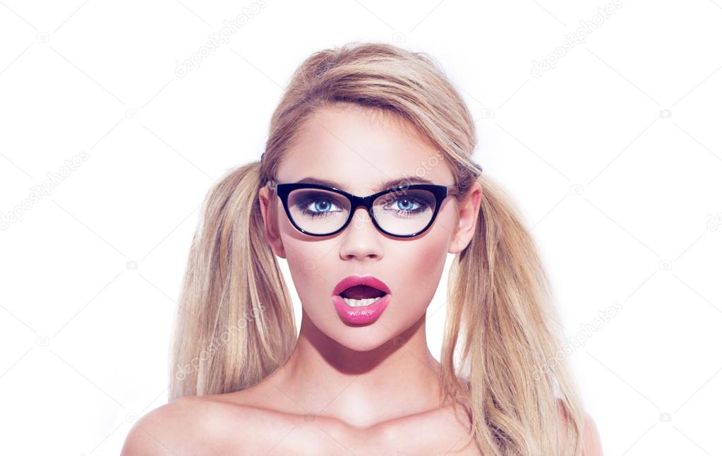 Sexy smart blonde wondering woman in glasses with pigtails isola