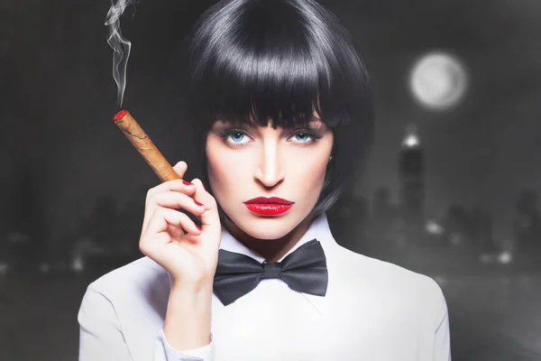 Sexy mafiosi woman boss in tux smoke with cigar — Stock Photo, Image