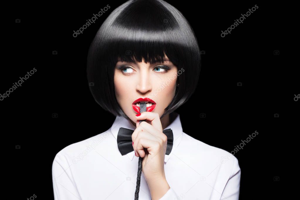 Sexy woman with red lips in wig bite whip portrait