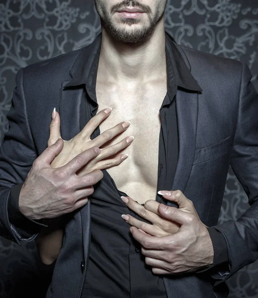 Sexy stylish rich man undressed by woman hands closeup — Stock Photo, Image