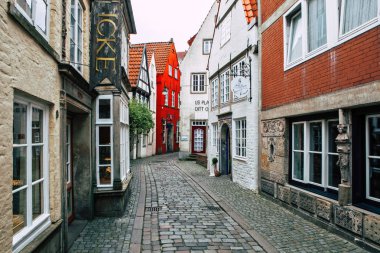 Bremen, Germany - April 29, 2017: In the quarter Schnoor, an old town street in downtown Bremen, UNESCO World Heritage Site clipart