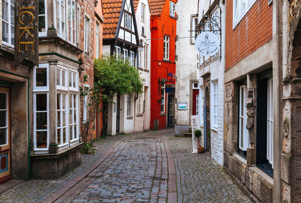 Bremen, Germany - April 29, 2017: In the quarter Schnoor, an old town street in downtown Bremen, UNESCO World Heritage Site