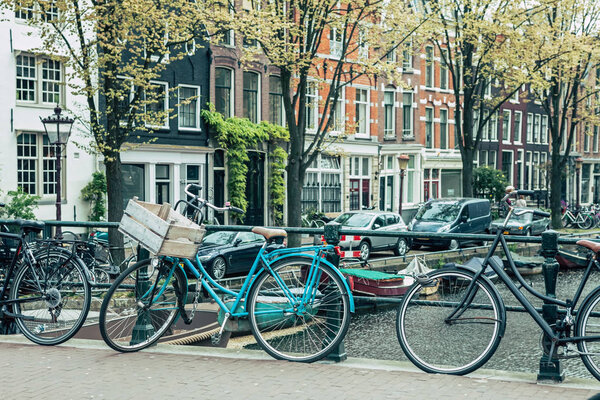 Retro bikes in front of Amsterdam canals, Netherlands