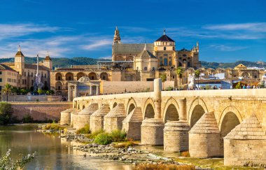 Roman Bridge across the Guadalquivir river and Mosque-Cathedral in Cordoba, Spain clipart