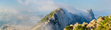 Rock of Gibraltar in fog. A British Overseas Territory clipart