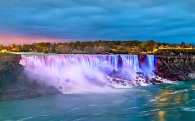 The American Falls and the Bridal Veil Falls at Niagara Falls as seen from Canada clipart
