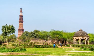 Qutb Minar and Chhatri at the Quli Khan Tomb. Delhi, the capital of India clipart