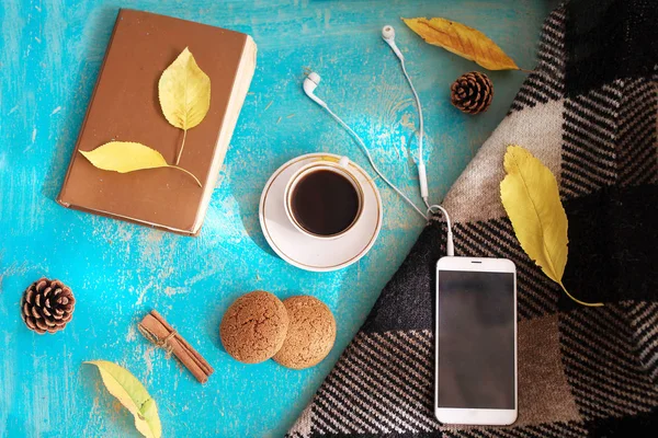 Hot  coffee, vintage book and autumn leaves and oatmeal cookies