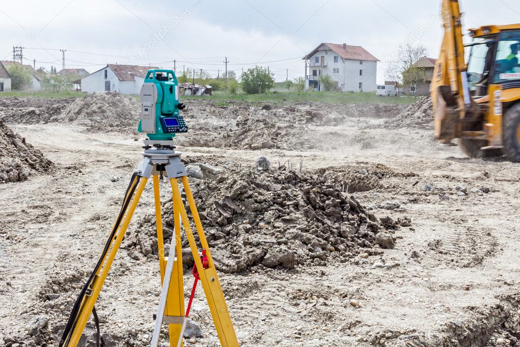 Geodesist device on a building site. Civil engineer with theodol