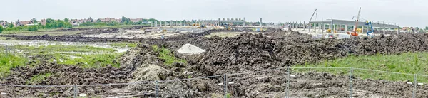 Panoramic view on the construction site above the fence wire — Stock Photo, Image