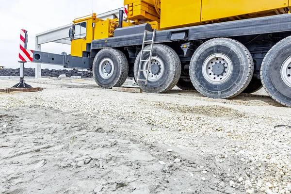 Low angle view on big crane's wheels, undercarriage — Stock Photo, Image