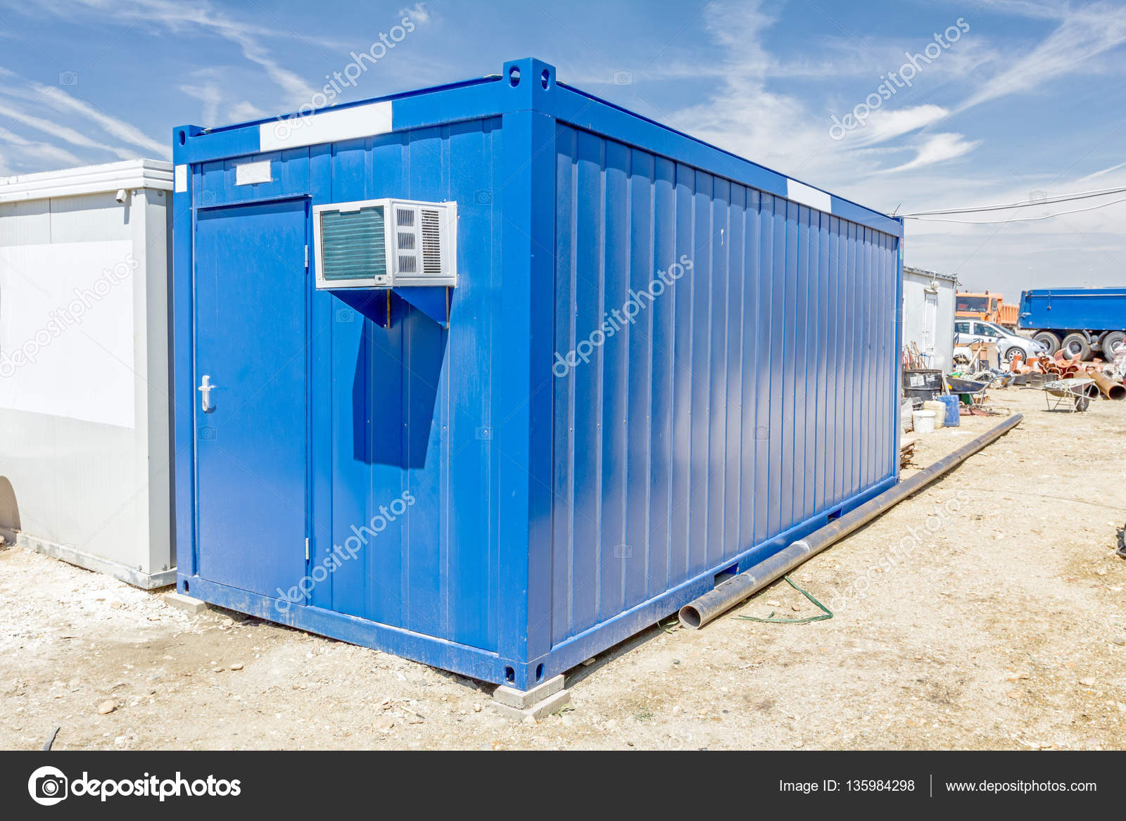 Air compressor is set on the outside wall of container office — Stock