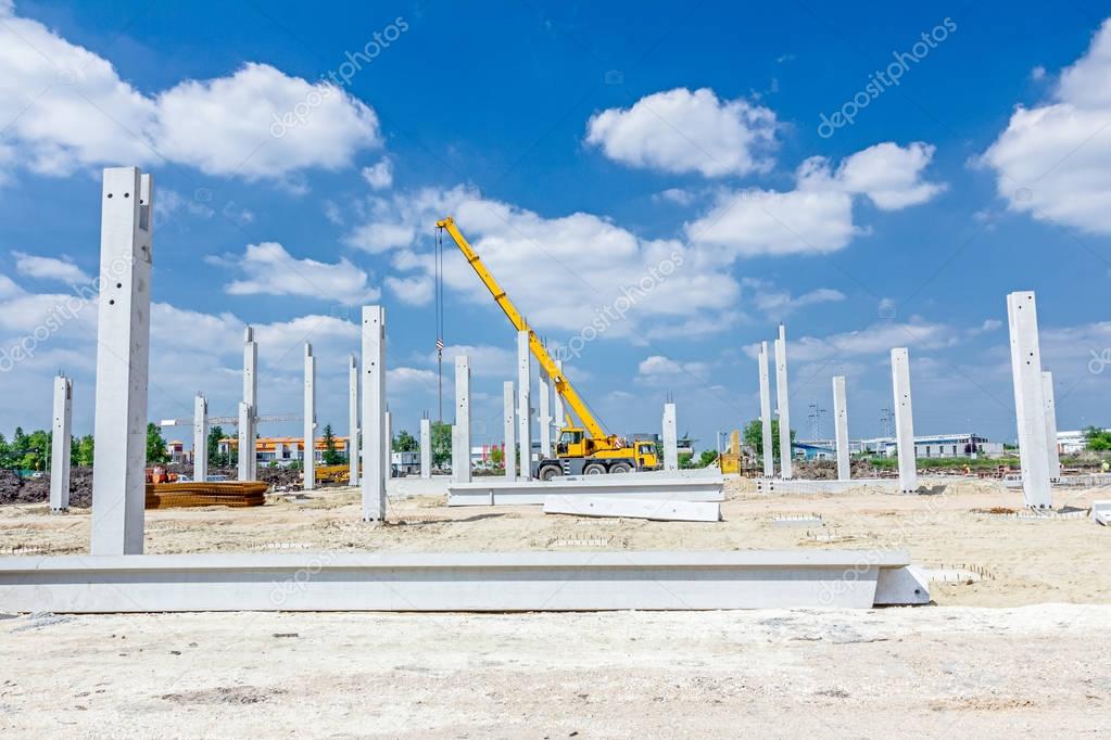 Concrete pillars of new edifice with a beautiful sky are placed 