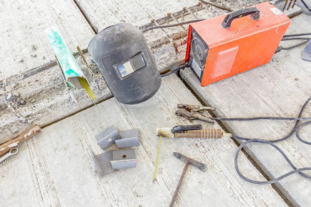Welding equipment with shield and welder torch, necessary tools