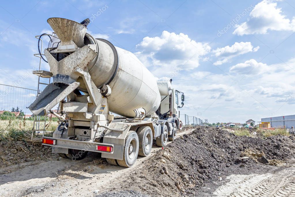 Back side view on concrete mixer, ready for pouring into transpo