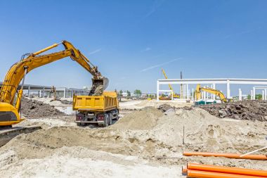 Site oluşturma Ekskavatör kazma.