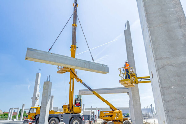 High elevated cherry picker with people who are working.
