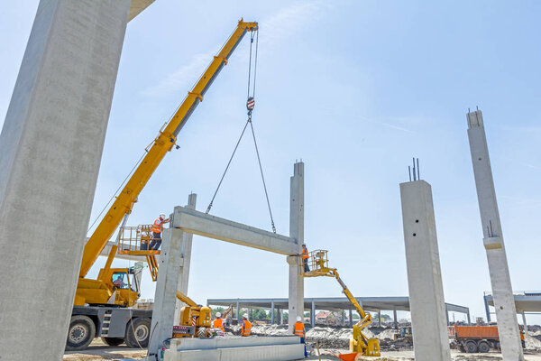 High elevated cherry picker with people who are working in heavy