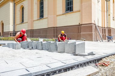 Masonlar kaldırım taşı, ekip çalışması uygun olan