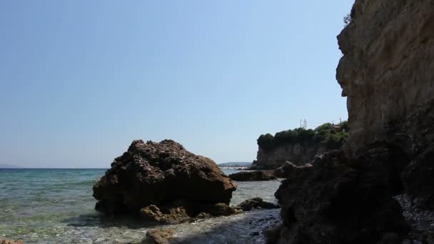 Sea erosion of rugged cliffs on rocky coastline — Stock Video