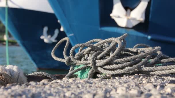 Two big fishing boats are tied up with rope for the dock, marina — Stock Video