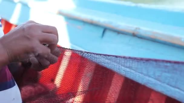Fisherman is repair the fish net — Stock Footage Fisherman is repair the fish net Stock Video