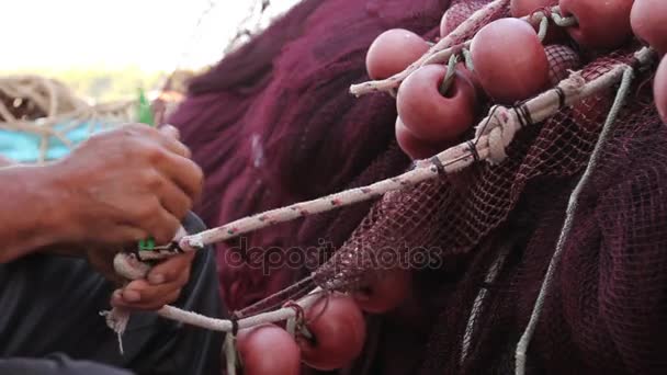 Needle with thread in fisherman hands repairing net for angling. — Stock Footage Needle Thread Fisherman Hands Repairing Net Angling Stock Video