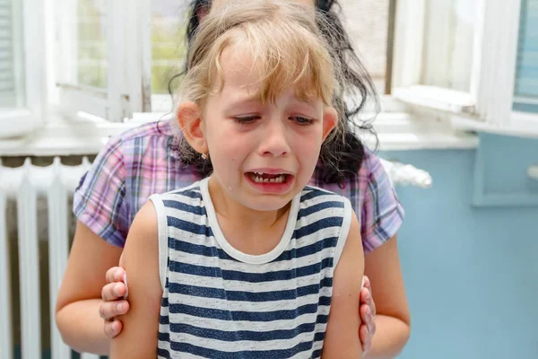 Frightened sweet little girl with tears on her face after vaccin — Stock Photo, Image