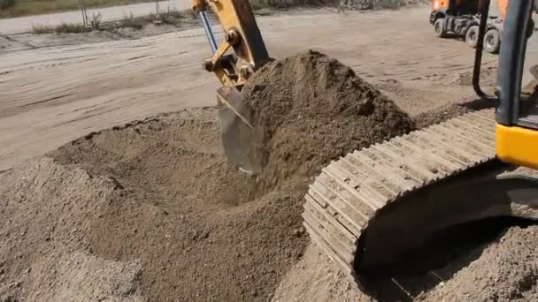 Excavator Preparing Pile Sand Loading Truck Building Site Yellow Excavator — Stock Video